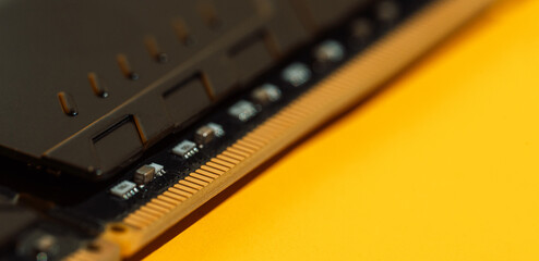 Black RAM module corners on yellow background with copy space. High quality photo