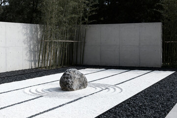 Zen garden with raked gravel, rock, and bamboo for meditation and tranquility