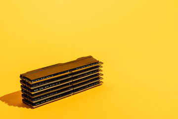 Stack of RAM memory modules on bright yellow background. High quality photo