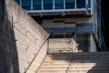 Exterior concrete stairs in modern urban architecture highlighting structure geometry, minimal design detail and refined architectural composition