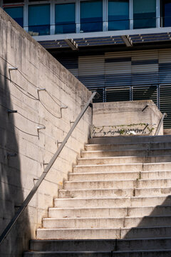 Modern urban architecture stairs in concrete exterior displaying structural geometry, clean design detail and contemporary architectural rhythm