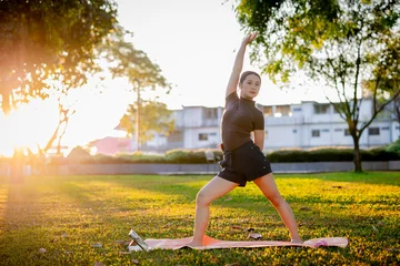Fotobehang Lotusbloem A young African woman finds zen through a healthy lifestyle, practicing a seated lotus pose for meditation and mental relief.  © Pang