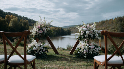 Outdoor wedding ceremony with a wooden arch and flowers.
