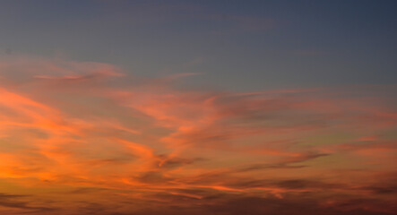 Minimal sky background with glowing sunset hues and clouds