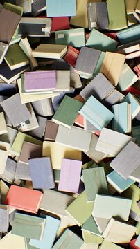 High angle shot of various books spread randomly on the ground with a slow forward zoom. 3D animation. Vertical. 4K.