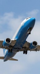 Blue Airplane Taking Off Against