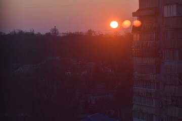 Sunrise in the city. The sun goes up over the city in winter