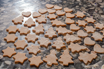 Christmas gingerbread cookie cutouts on countertop