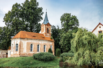 Old Rural Church In Green Landscape