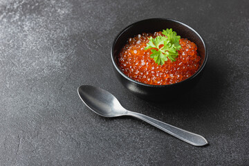 Red caviar with parsley in bowl