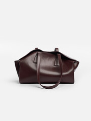 Naklejka premium Woman leather bag on a white background