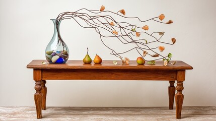 a beautiful tree branch with leaves and flowers is placed on the table