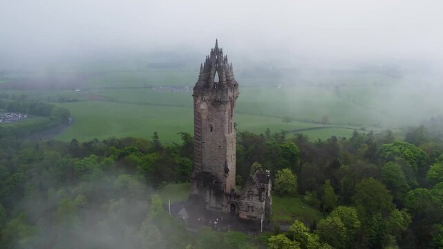 Wallace Monument Emerging from Mist in Scotland