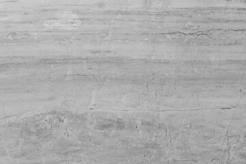 Obraz premium Clean white marble stone texture with sharp branch-like black veins and a fractured natural pattern, perfect for minimalist interior design and high-end bathroom surfaces.