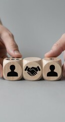 Business Partnership Concept Dice Showing People and Handshake