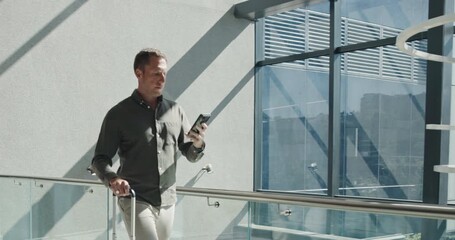 Reading, phone and man in airport for business trip, booking transportation and client update email. Mobile, walking or advisor with luggage for overseas travel, review work schedule or check message