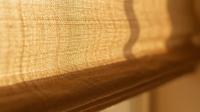Beige fabric blind closeup, natural light and shadows, warm color