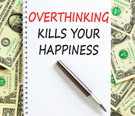 Overthinking kills your happiness symbol. Concept words Overthinking kills your happiness on white note. Beautiful dollar bills background. Business overthinking kills happiness concept. Copy space.