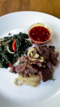 Beef Sei is Indonesia traditional smoked beef served with boiled cassava leaves