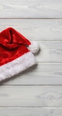 Santa Hat on Wooden Background Christmas Holiday Festive Concept