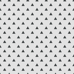 Tile vector pattern with black triangles on grey background 