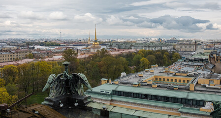 View of St. Petersburg Skyline With Green Trees and Historical Architecture Under a Cloudy Sky