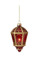 Ornate red and gold lantern Christmas ornament with a glowing internal light and glitter scroll patterns isolated.