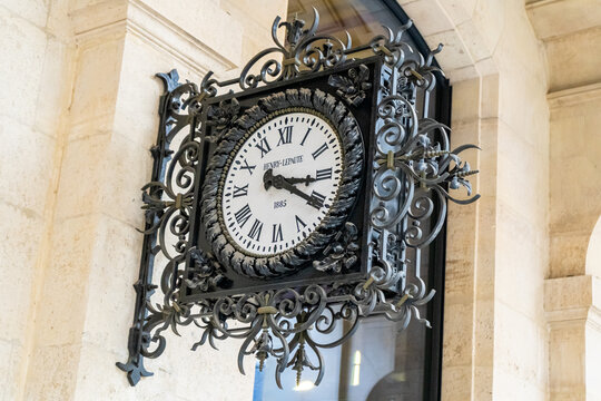Paris, France - October 29, 2025: Old clock Henry Lepaute 1885 on wall LA POSTE Paris Louvre post office.