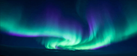 Aurora are delicate, undulating bands of green-violet light, pulsating atmospherically and mystically over the dark horizon. It is suitable for natural backgrounds, album covers.