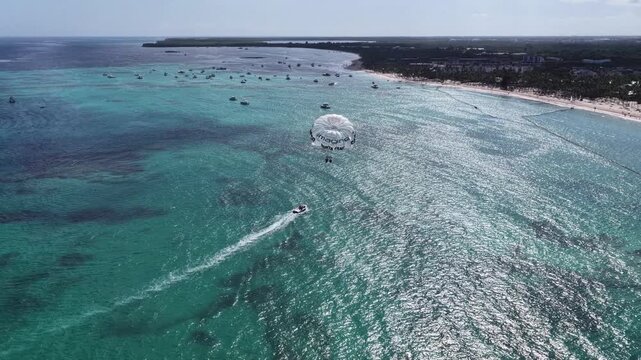 Parasailing At Bavaro In Punta Cana Dominican Republic. Caribbean Skyline. Beach Landscape. Nature Seascape. Parasailing In Bavaro In Punta Cana Dominican Republic. Scenic Water Sport.