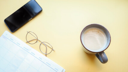 Flat lay background, workplace with coffee cup and documents, flat lay, coffee break