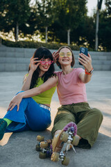 Positive women with stylish eyeglasses captures moment  after roller skating, vertical


