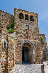  Italy - Bagnoregio - Civita di Bagnoregio - Porta Santa Maria fortified gate with arched passage and loggia above, historic entrance to the village