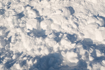 Uneven fluffy snow. Snowy background for publication, poster, calendar, post, screensaver, wallpaper, cover. High quality photo