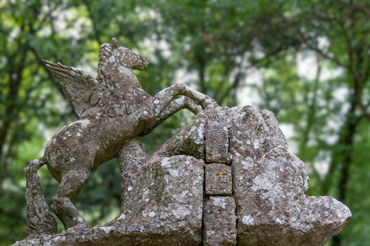 Italy - Bomarzo - Sacro Bosco - Fountain of Pegasus (Fontana di Pegaso), winged horse rearing over rocky basin in the Sacred Wood sculpture garden