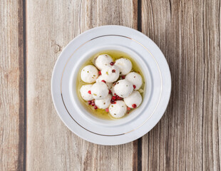 Boursin round creamy goat cheese in oil with red pepper