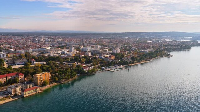 Aerial drone view of the wider Zadar urban area residential districts, modern buildings, coastline neighborhoods, and the Adriatic shoreline