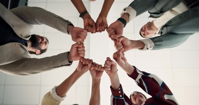 Below, team and fist bump in circle with unity, cooperation and collaboration for marketing goals. People, hands together or united in office with solidarity, connection and support for advertising.