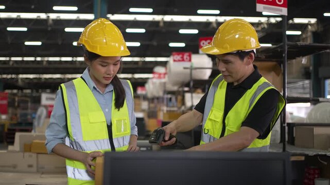 Blue collar workers are working at warehouse. Logistics, transportation.
