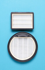 Vacuum cleaner filters on blue background