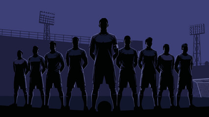 Silhouette of a soccer team standing in a stadium at night with floodlights © AHMAD KHOIRI