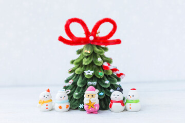 Santa claus and snowman doll with Christmas tree on white background, Christmas card background idea