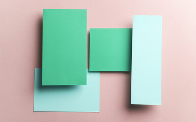 Fototapeta premium Set of green floating blank card sheets with shadow on pink background. Minimalism business brand template, creative layout