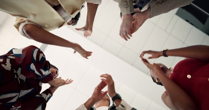 Below, team circle and applause in office with success, solidarity and achievement of marketing goals. Happy, people and clapping with celebration, collaboration and accomplishment for advertising.