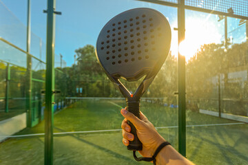 Close up Padel players hand on court background. Open social tour template. Padel tennis player on the sky background outdoors. Paddle tenis template for bookmaker design ads with copy space.