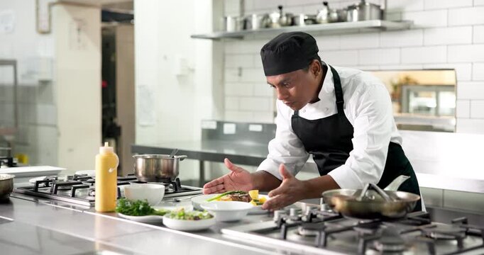 Plate, man and chef in kitchen for cooking at restaurant for meal preparation, presentation or garnish. Food, hospitality career and male culinary worker for cuisine flavor with catering at diner
