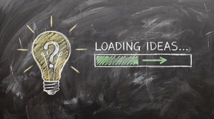 Creative ideas loading on blackboard with lightbulb and question mark
