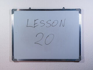 Whiteboard showing educational LESSON concept representing learning steps and knowledge development
