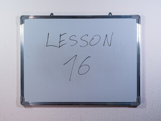 Whiteboard showing LESSON concept representing teaching, explanation and educational content