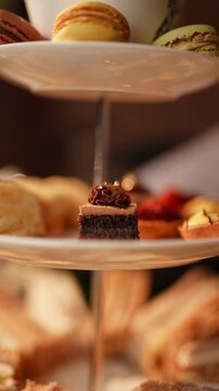 A dessert plate with a small dessert on it and a sign that says "Piercer and Curioser" above it